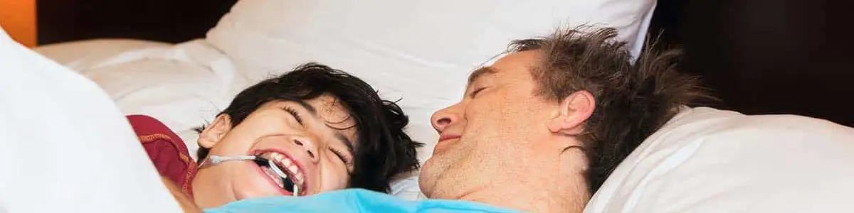 Dad and disabled son laughing