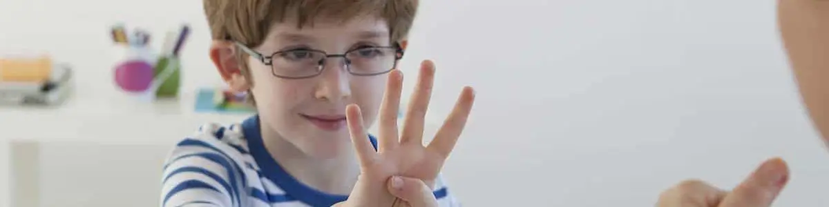 Child learning speech therapy