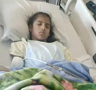 Girl with cerebral palsy in hospital