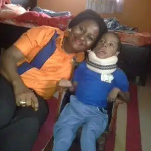 The Sedoo Initiative for Children with Special Needs - worker and child